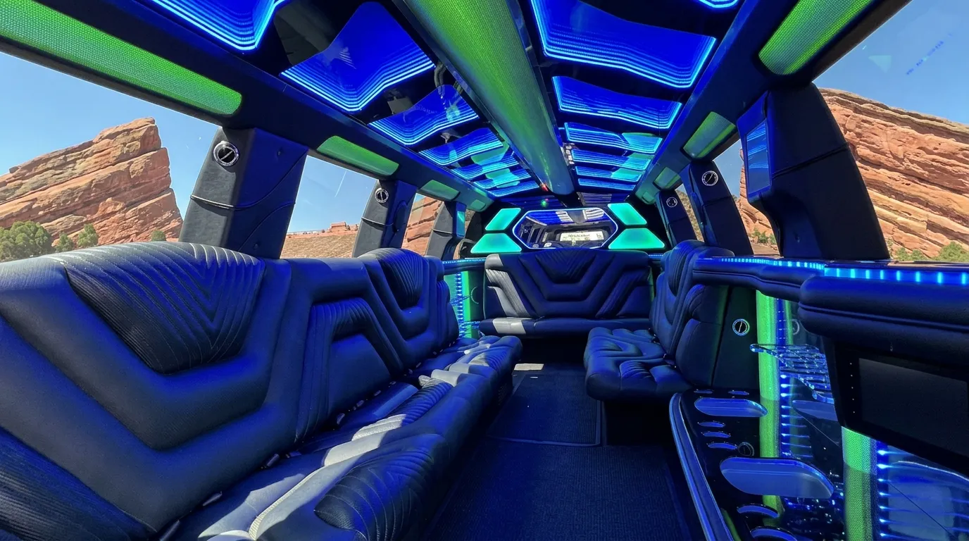 Inside the Chevy Suburban limo in Vail: LED light-show ceiling, leather lounge seating and lit bar